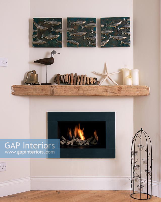 Fireplace with nautical accesories on shelf