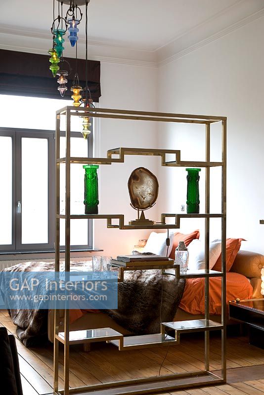 Decorative metal shelves in modern bedroom