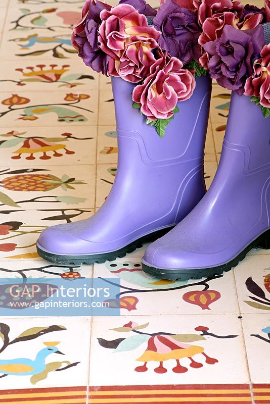 Wellington boots on tiled floor 