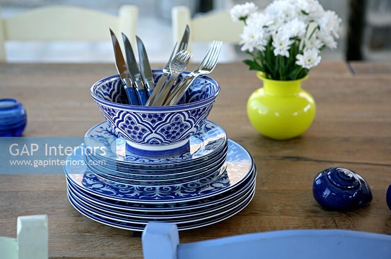 Blue and white crockery on dining table 