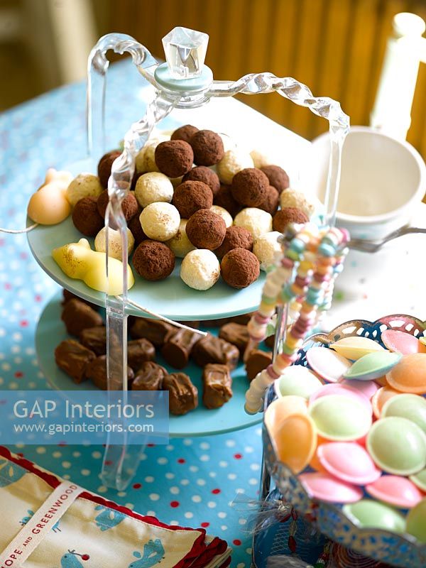 Cake stands full of chocolates and sweets 