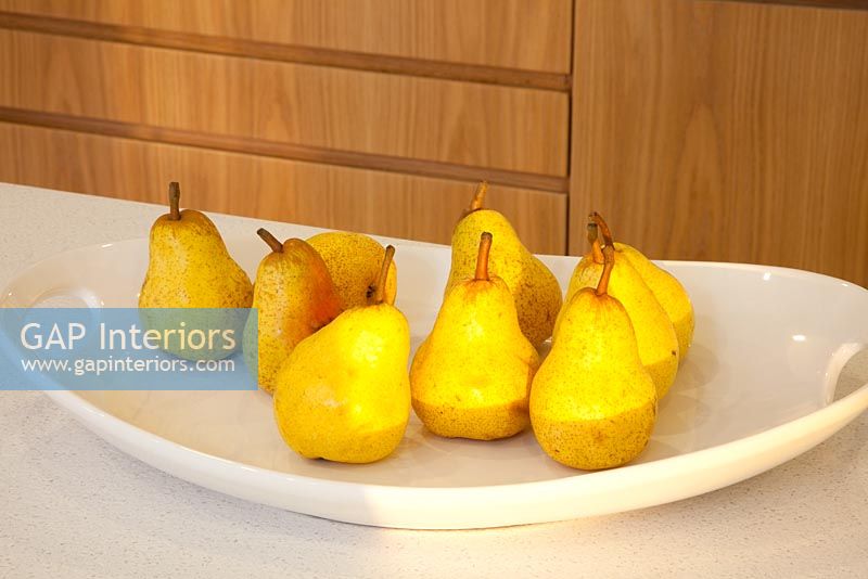 Pears on plate in kitchen 