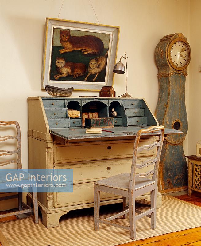 Wooden writing desk in rustic study 