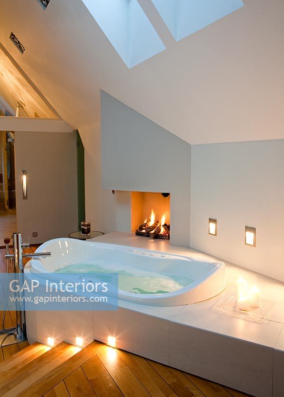 Bath and fire in modern bedroom 