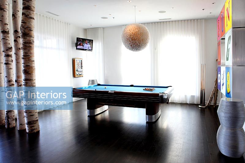 Modern games room with pool table 