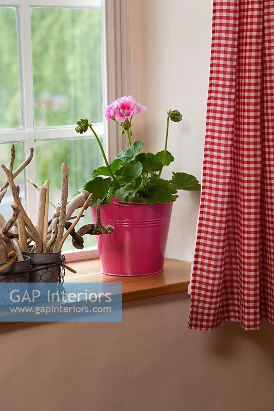 Pink gingham curtains in country bathroom 