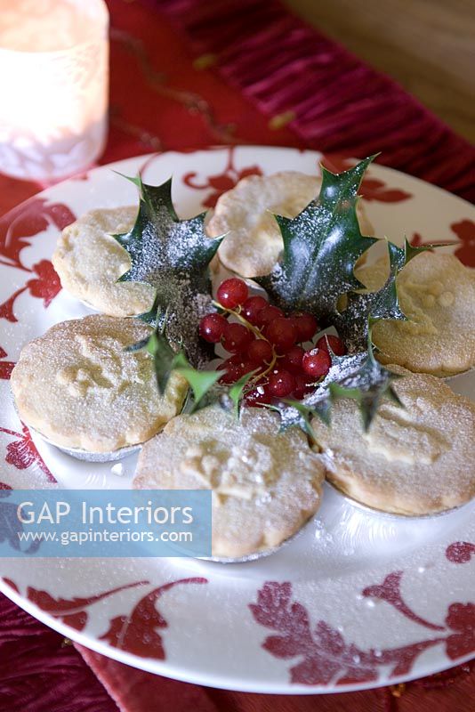 Mince pies on red and white plate 