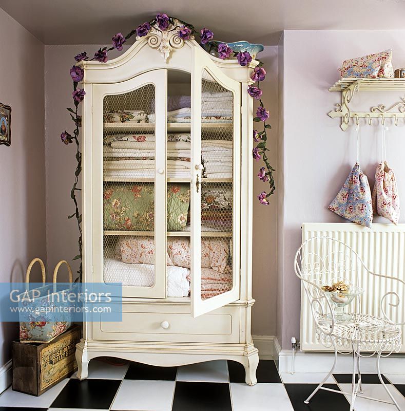 Linen cupboard with floral bedding