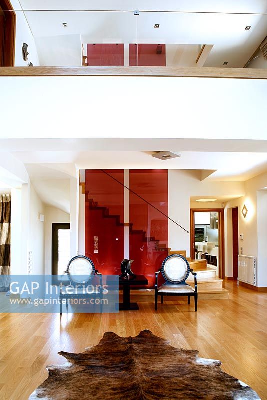 Red glass panels on modern staircase 