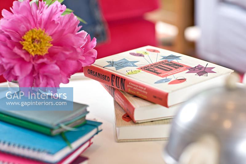 Flowers and books on coffee table detail