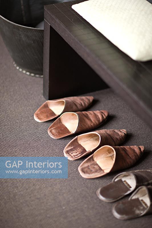 Leather slippers in modern bedroom detail 
