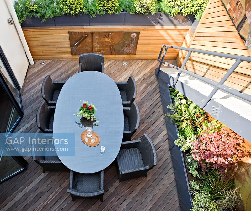 Modern roof terrace with dining table 