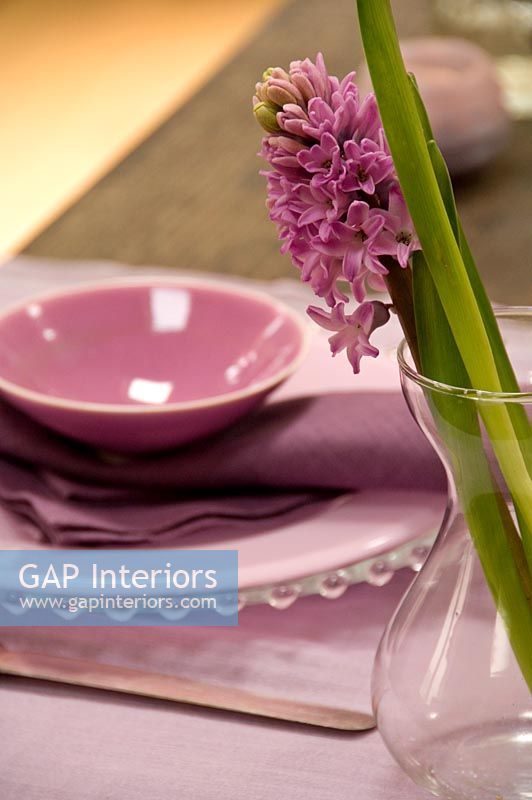 Dining table place setting with hyacinth.