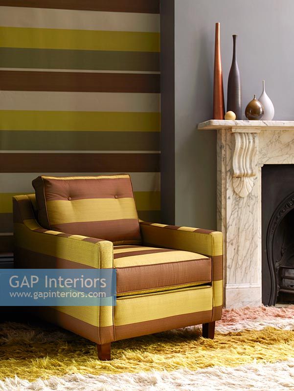 Modern stripey armchair and feature wall 