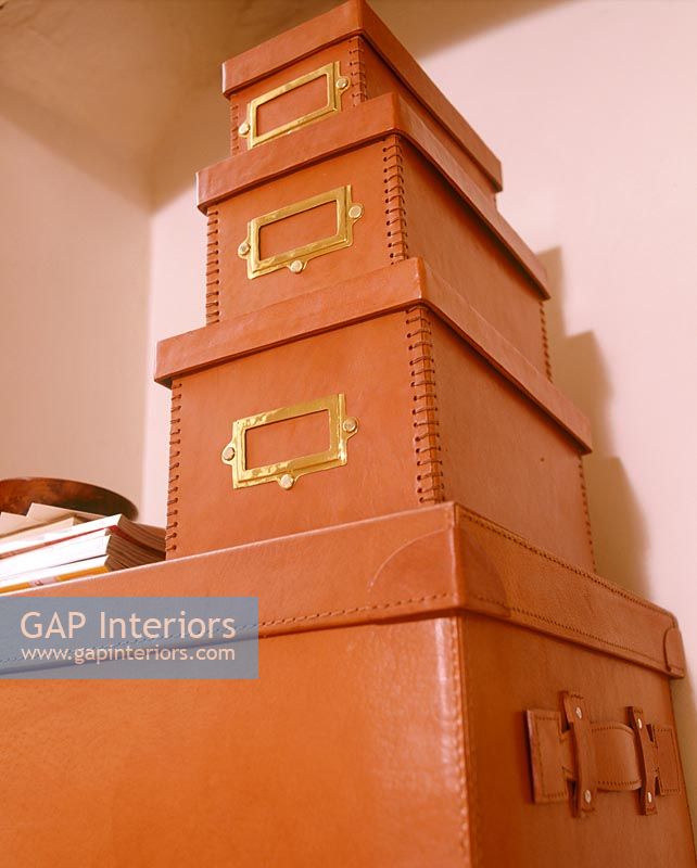 Stack of leather storage boxes 