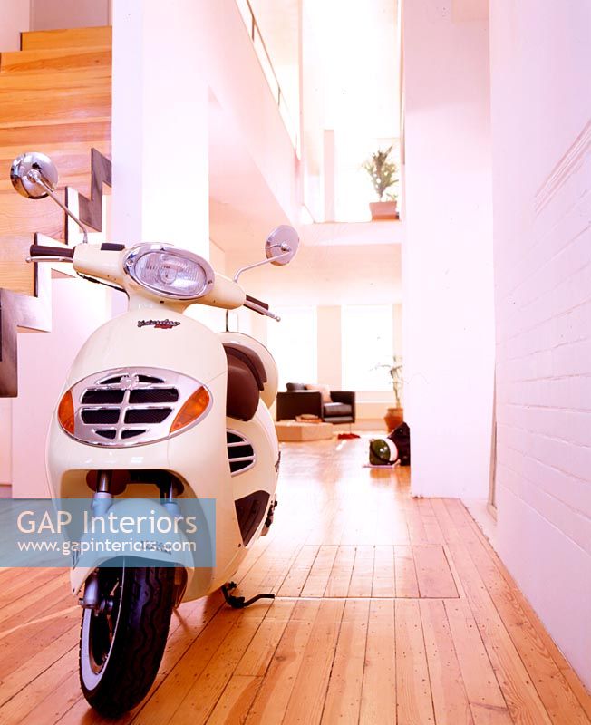 Scooter parked in modern hallway 