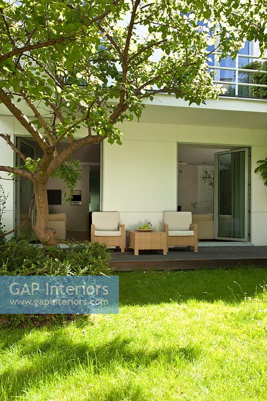 Garden furniture on modern house terrace 
