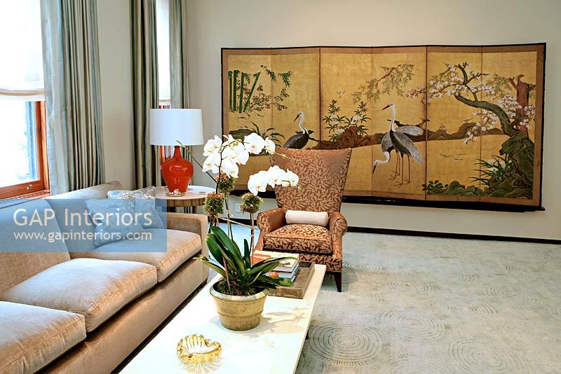 Modern living room with decorative tapestry 