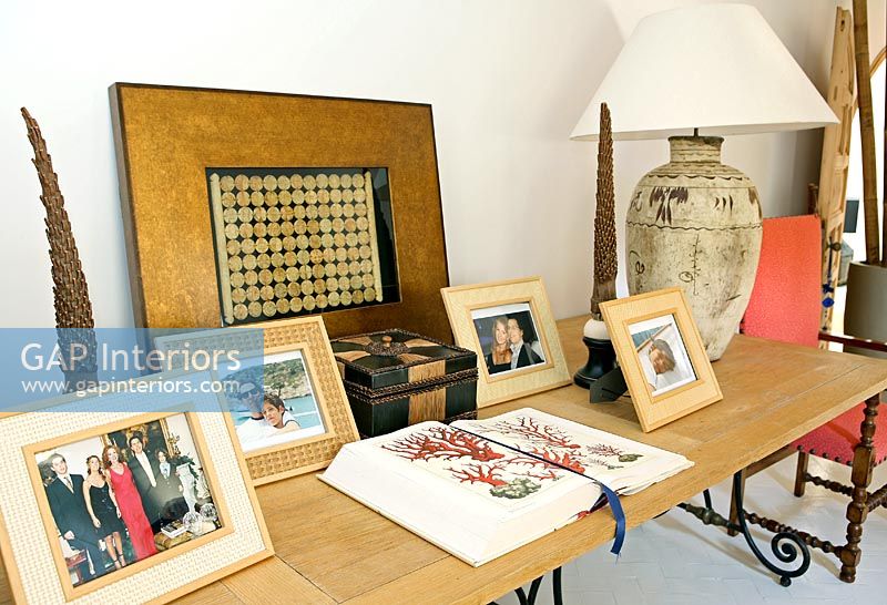 Sideboard full of family photographs 