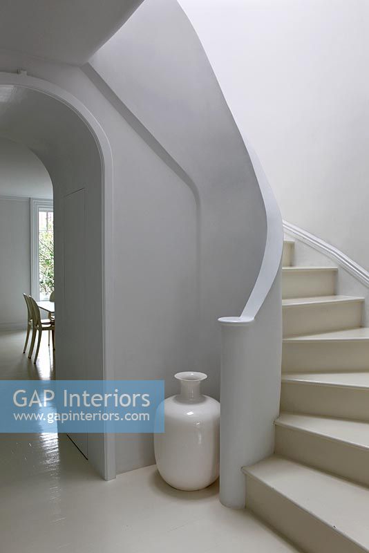 Modern white curved staircase 