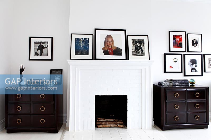 Fireplace and chests of drawers in bedroom 