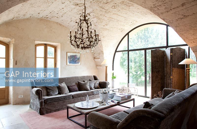 Country living room with vaulted ceiling