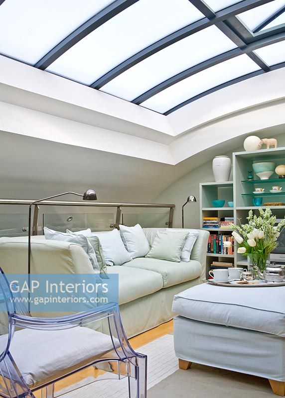 Modern living room with curved glass roof 
