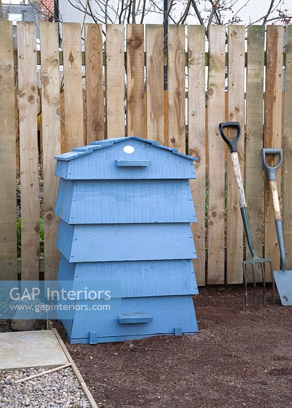 Blue wooden bee hive in garden 