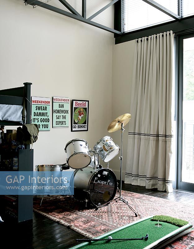 Modern teenagers bedroom with drum kit