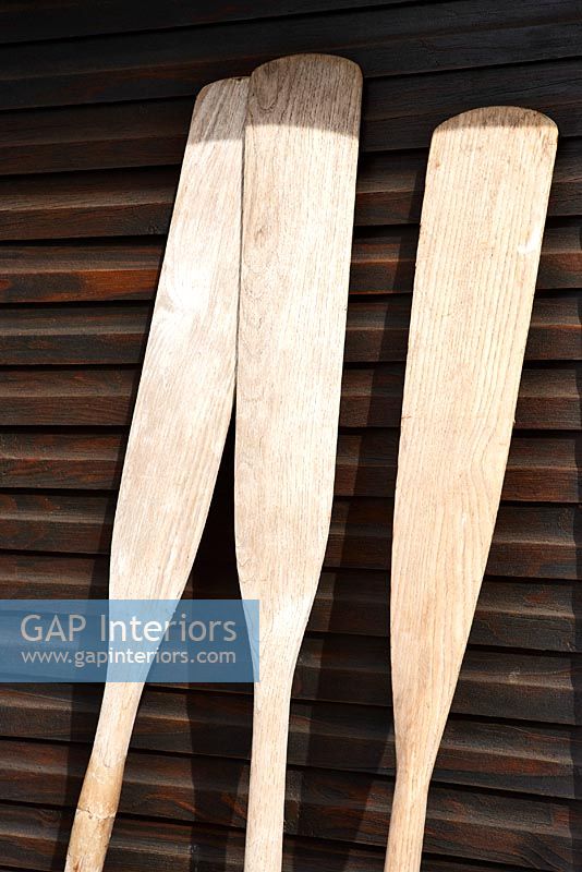 Three wooden oars, detail