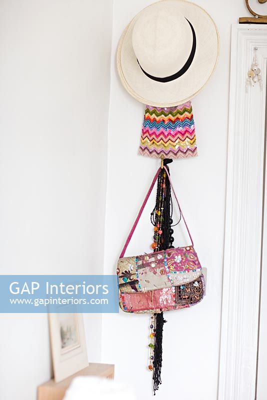 Hat, bags and accessories hanging on wall