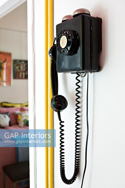 Black wall mounted vintage telephone