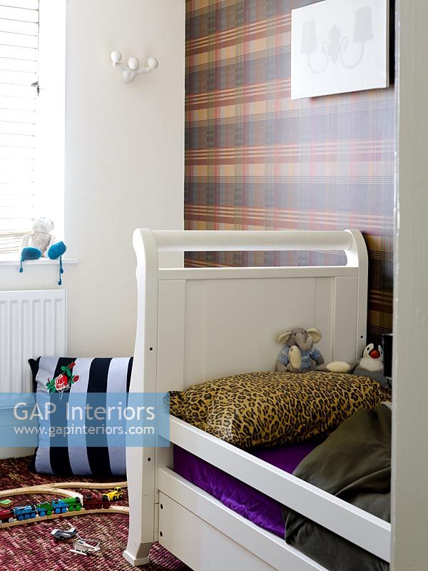 Childs room with tartan wallpaper