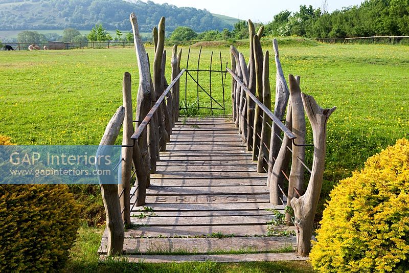 Wooden bridge in country garden