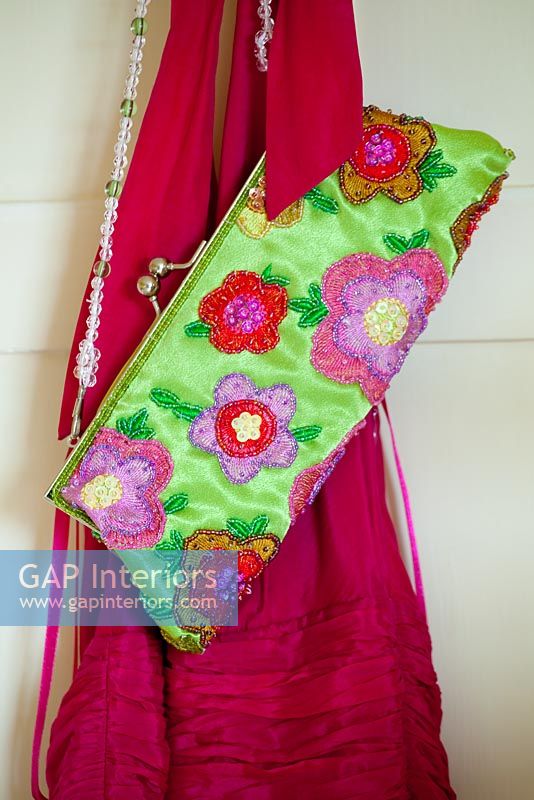 Clutch bag hanging with dress
