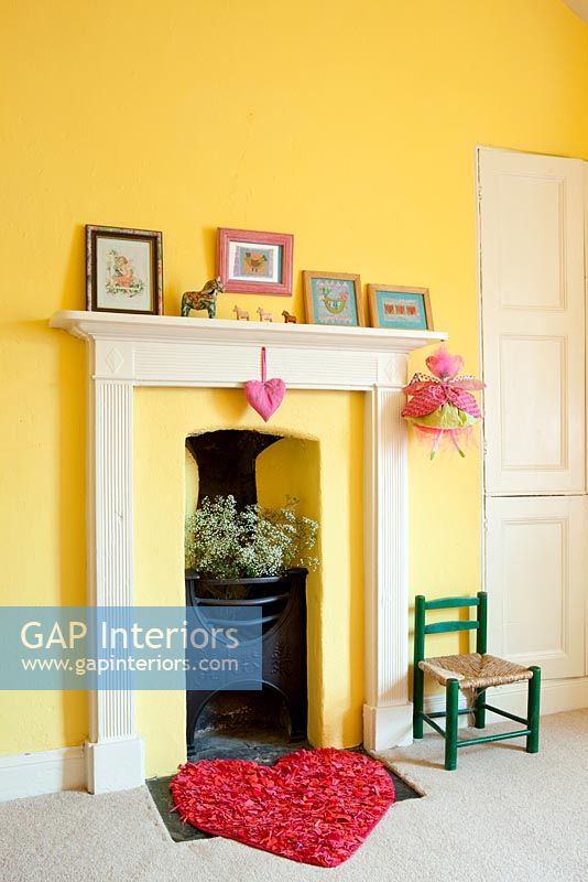 Small cast iron fireplace in childs room