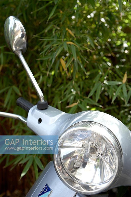 Silver scooter headlight, detail