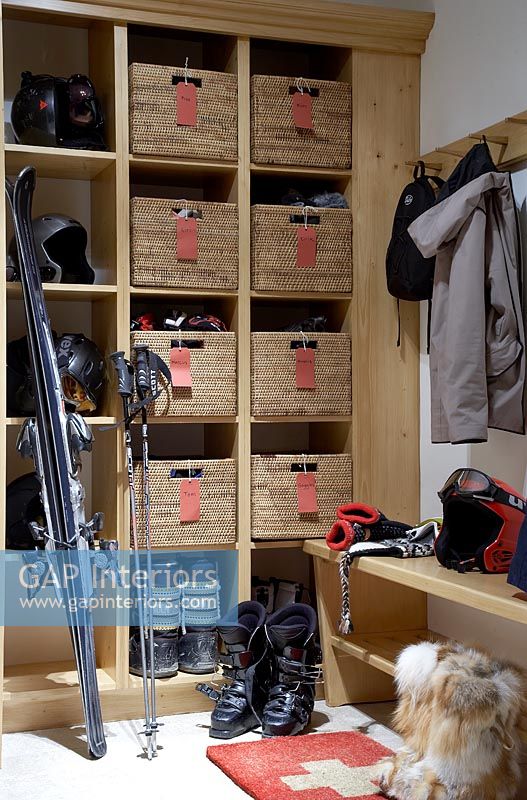 Ski equipment in modern cloakroom 