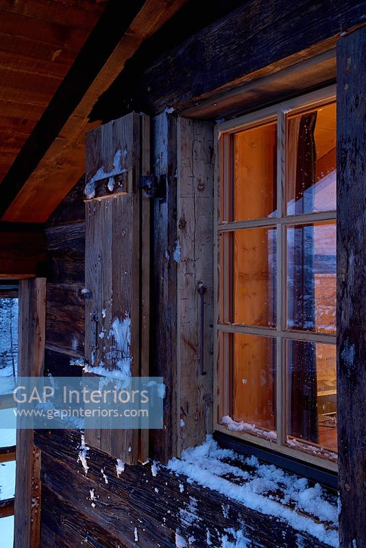 Snow covered chalet window exterior