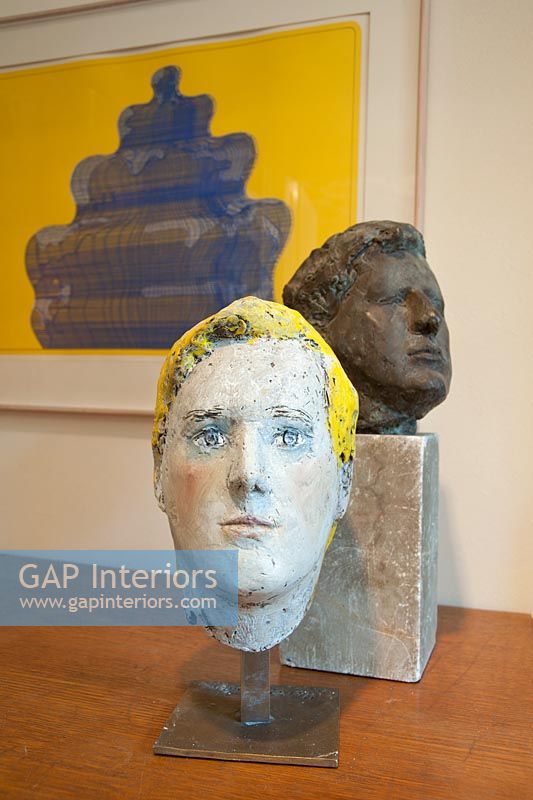Clay and bronze heads with colourful painting