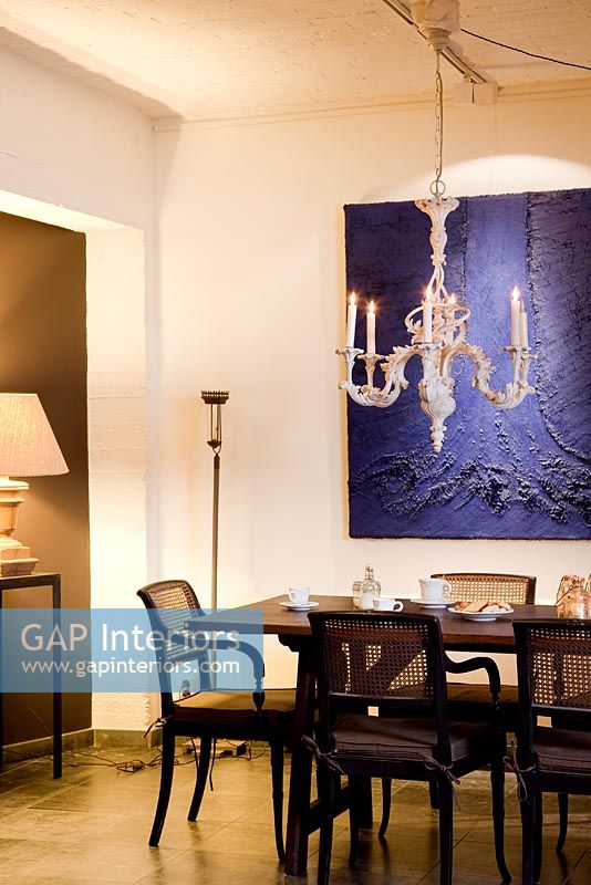 Classic dining room with modern artwork