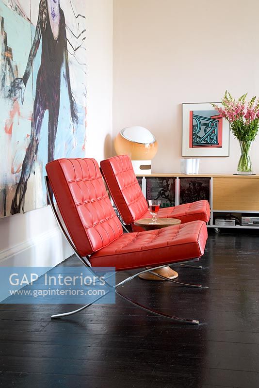 Red leather retro chairs in living room