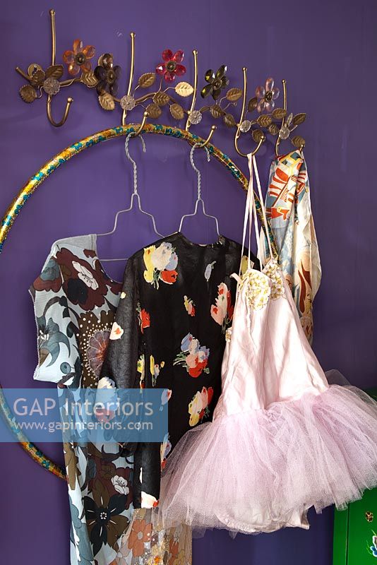 Floral coat hooks with patterned dresses