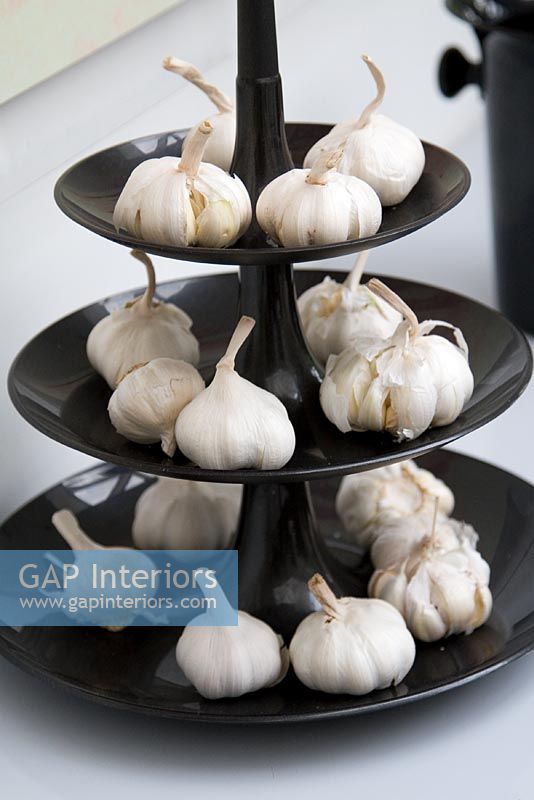 Contemporary cake stand with garlic bulbs