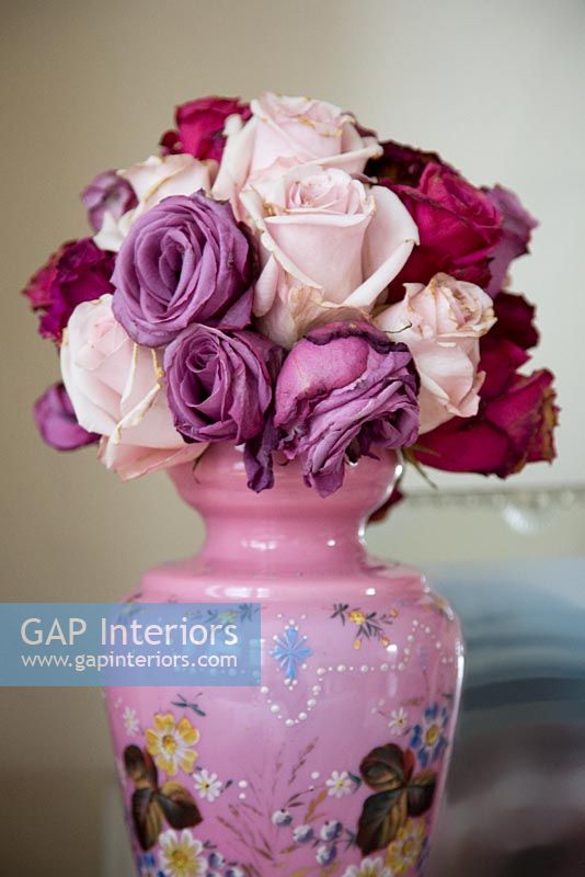Vintage roses in colourful vase