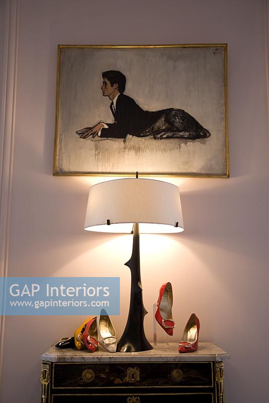 Painting and display of shoes with lamp