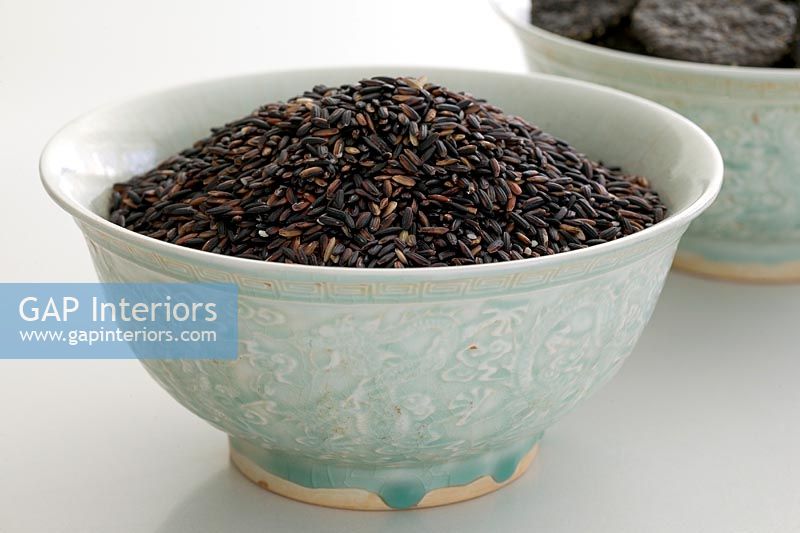 Black rice in pale blue bowl