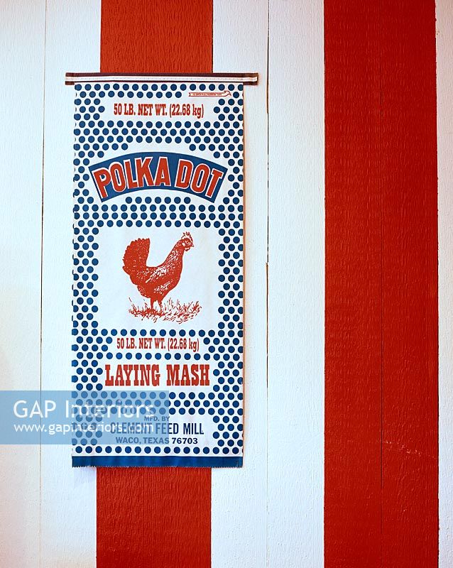 Poster on red and white painted panelling