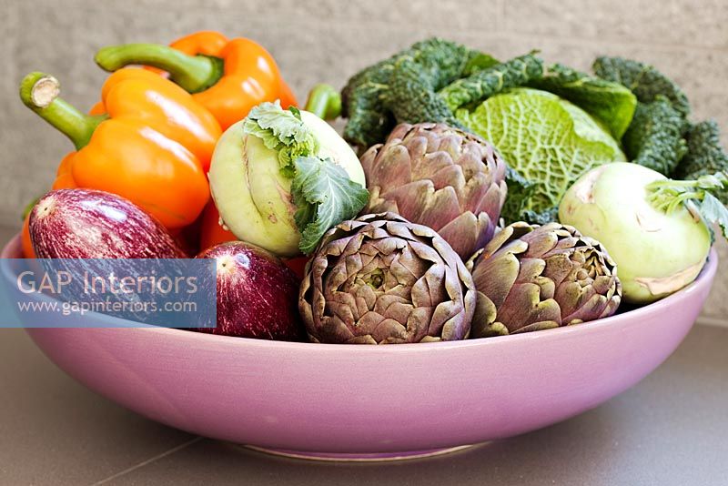 Vegetables in pink bowl