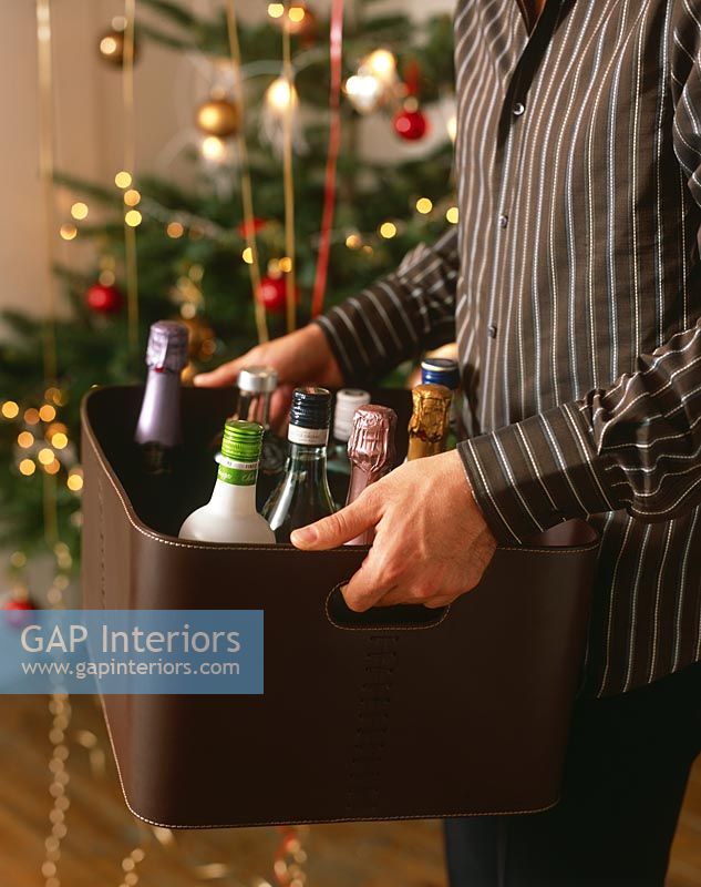 Man carrying box of alcohol at Christmas 
